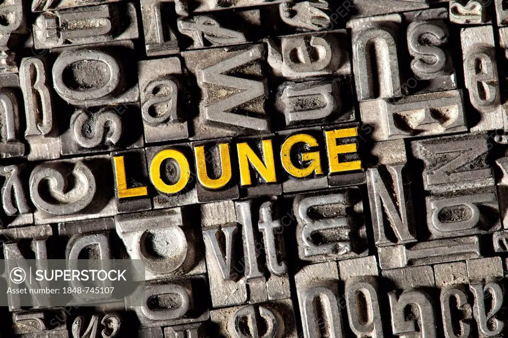 Old lead letters forming the word LOUNGE