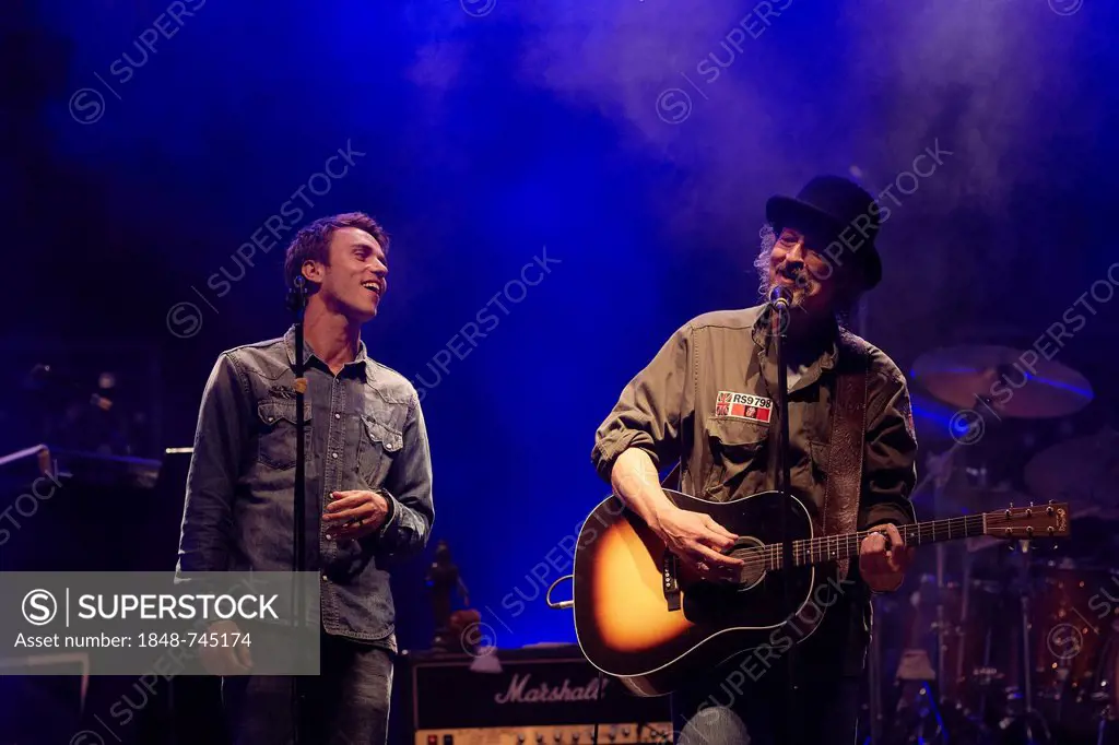 Wolfgang Niedecken, frontman of the rock group BAP, left, performing with Clueso during the final concert of the BAP tour, Loreley open air stage, St....