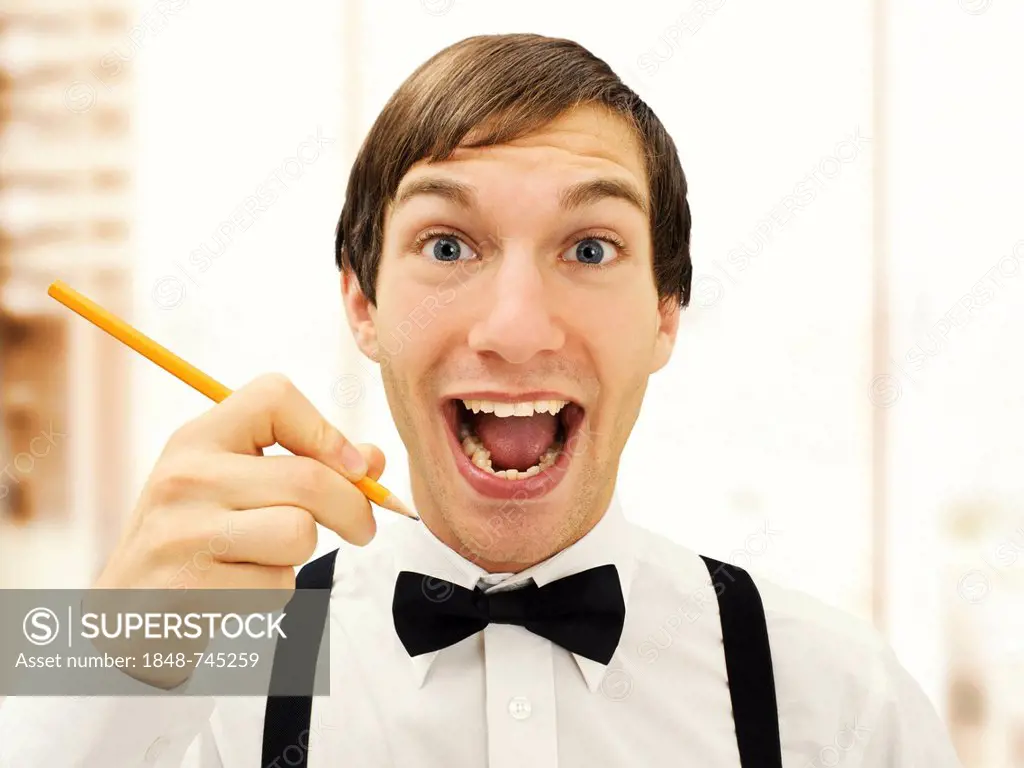 Smiling accountant, clerk at the office, hollding a pencil, portrait