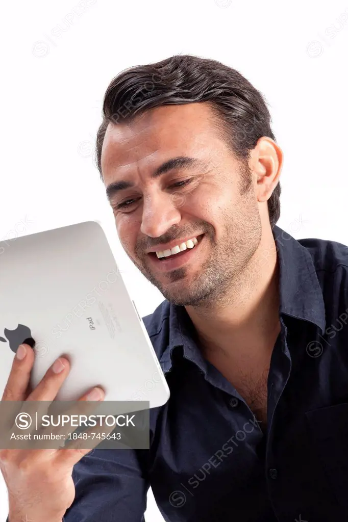 Smiling man holding an iPad