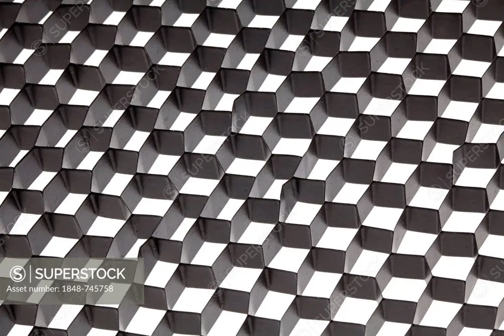 Honeycomb mesh of a spotlight, optical illusion