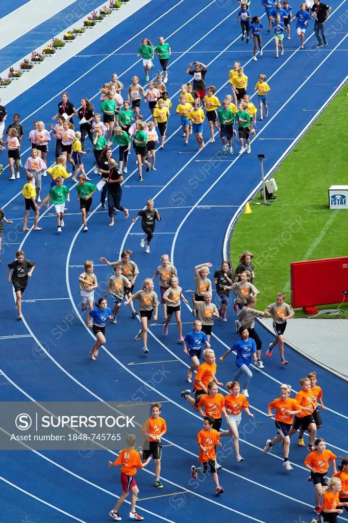 Athletic children of Berlin schools taking part in a running competition at the ISTAF 2012 at the Olympic Stadium, Berlin, Germany, Europe