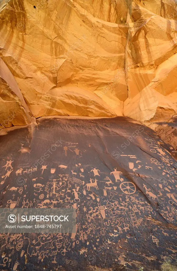 Petroglyphs carved into sandstone, representation of Fremont, Anasazi, Navajo and Anglo-Saxon cultures, prehistoric and historic rock art, Newspaper R...