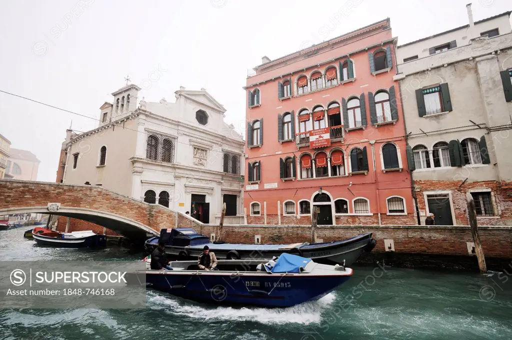 Boat on the canal Rio de San Antonin, Scuola di San Giorgio degli Schiavoni, Palazzo Schiavoni, Castello quarter, Venice, Venezia, Veneto, Italy, Euro...