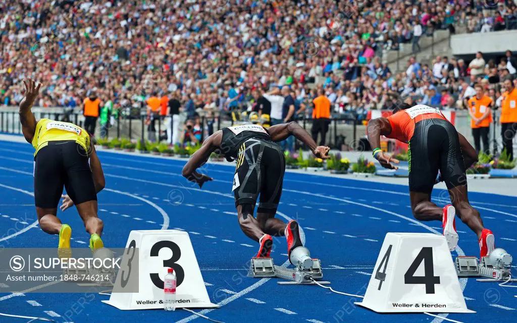 The 100-meter runners Michael Framer, Kim Collins and Kemar Bailey-Cole immediately after the start of the sprinting competition at ISTAF 2012, Berlin...