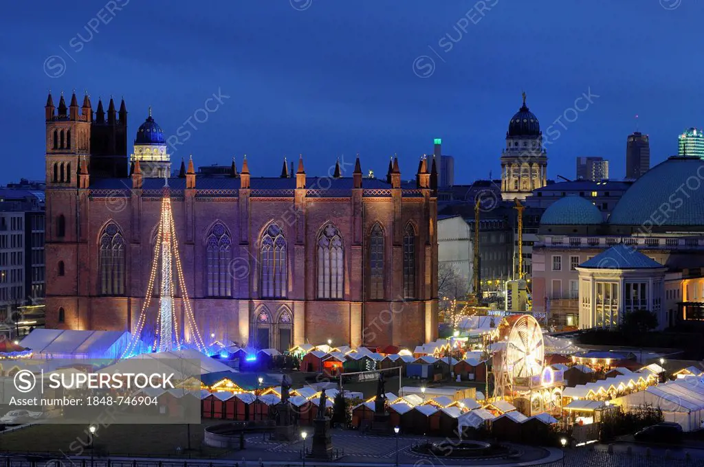 Christmas market at Opera Palais with the Friedrichswerderscher Church and domes of a French Cathedral and German Cathedral on Gendarmenmarkt square, ...