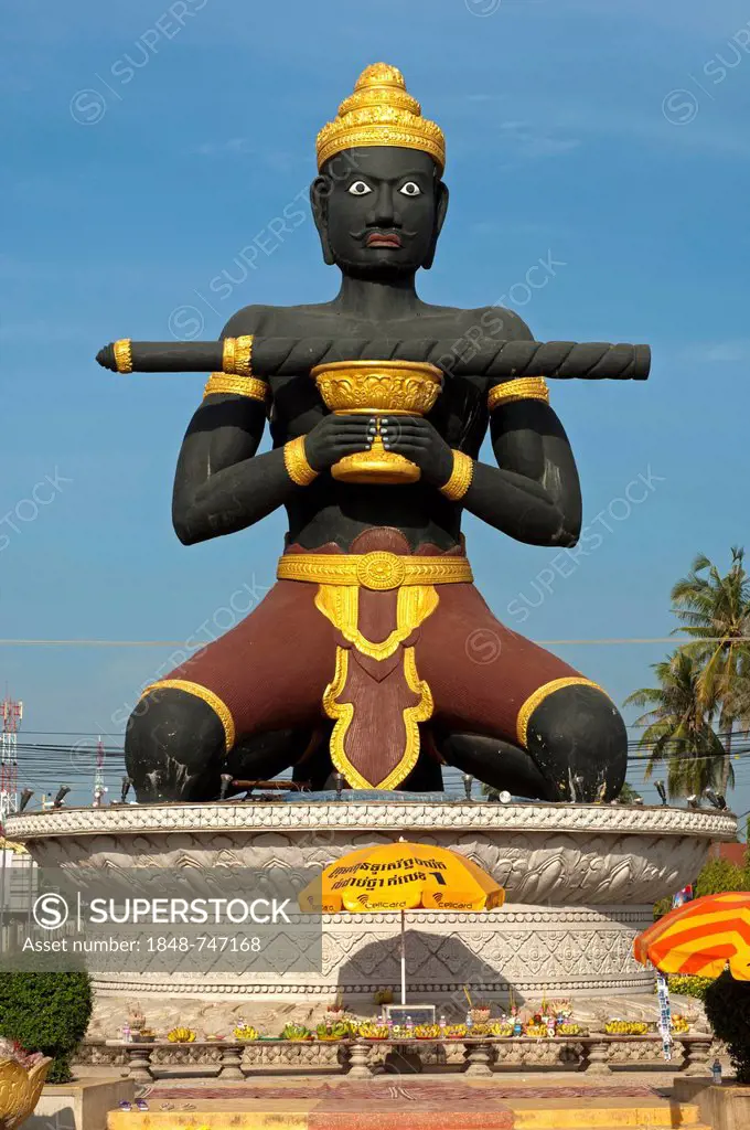 Statue of Ta Dambong, a black man with a magic wand, symbol of the provincial capital of Battambang, Cambodia, Southeast Asia, Asia
