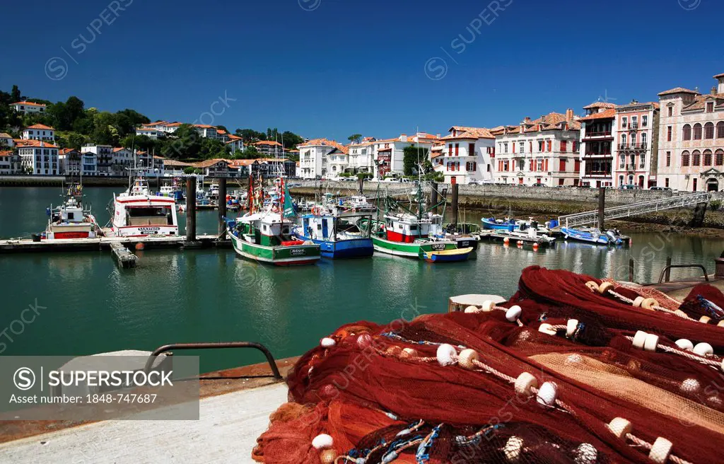 Fishing boats and fishing nets in the fishing port of Saint-Jean-de-Luz, in Basque: Donibane Lohizune, Pyrenees, Aquitaine region, Pyrénées-Atlantique...