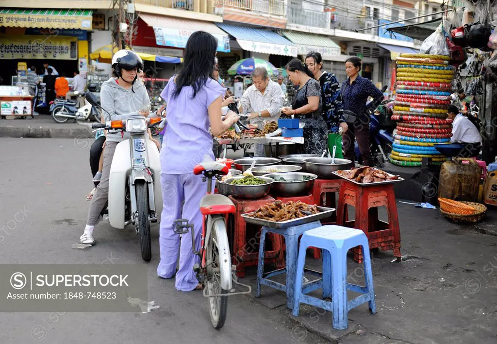 Women shopping at a street market in Phnom Penh, Cambodia, Asia
