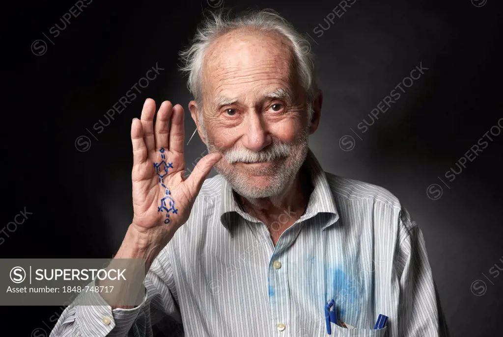 Elderly man with a chemical formula written on his hand
