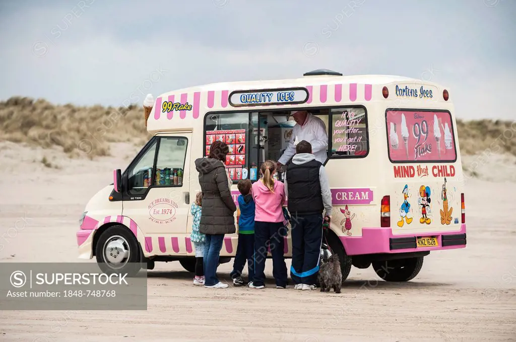 Ice cream truck with customers on Benone Beach, Castlerock, County Londonderry, Northern Ireland, United Kingdom