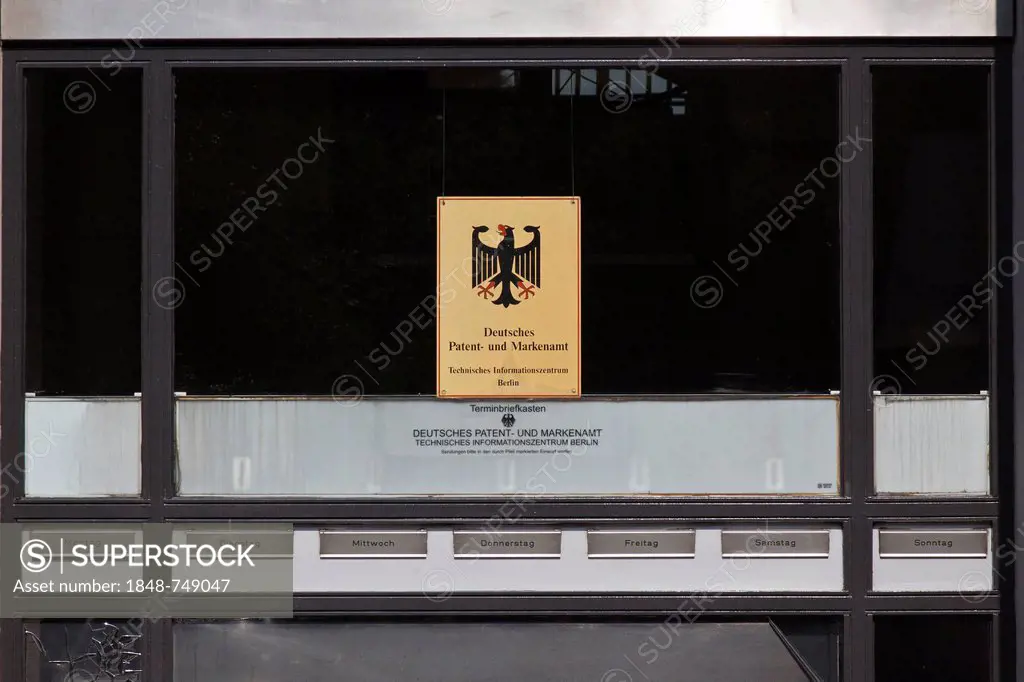 Sign, dirty window, lettering Deutsches Patent- und Markenamt, German for German Patent and Trade Mark Office, with one mailbox for each day of the we...
