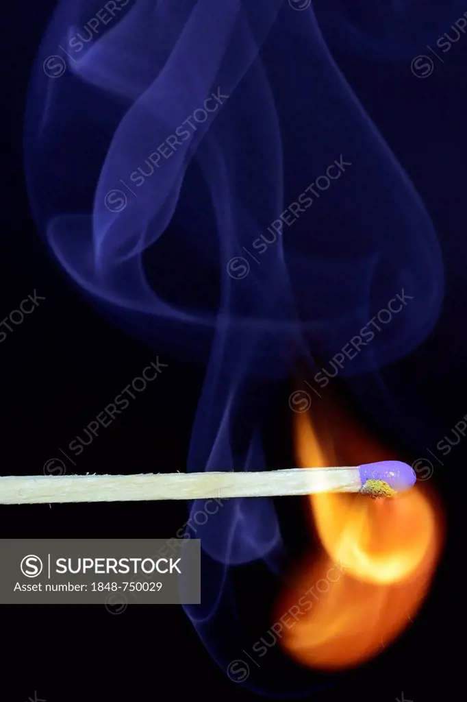 Matchstick being ignited, with blue smoke