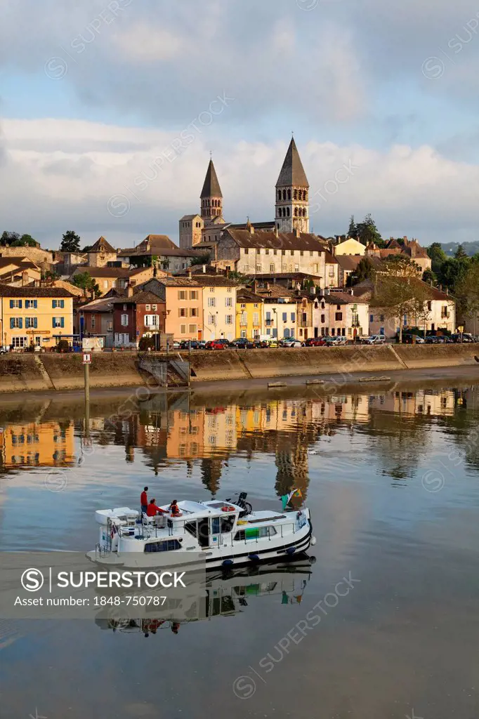 Abbey Church of St. Philibert and Saône river with houseboat, Tournus, Département Saône-et-Loire, France, Europe