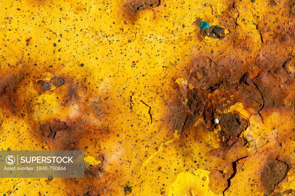 Metal surface with rust and remains of yellow paint