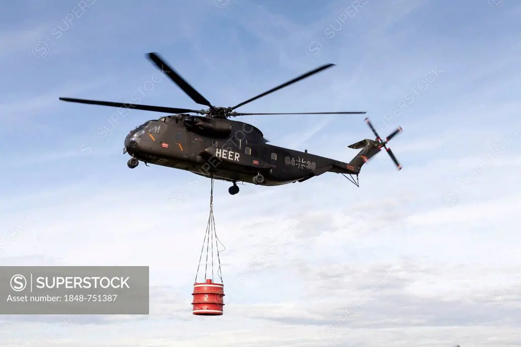 CH-53 helicopter carrying a 5000-liter water tank during an exercise, Laupheim, Baden-Wuerttemberg, Germany, Europe
