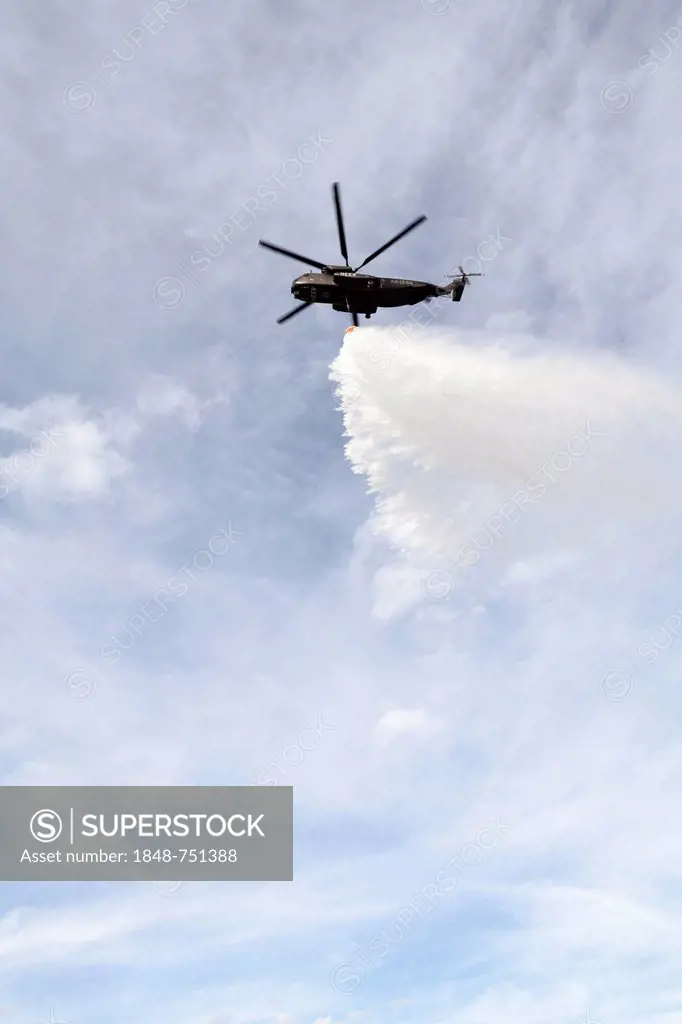 CH-53 helicopter carrying a water tank during an exercise, dropping 5000 liters of water, Laupheim, Baden-Wuerttemberg, Germany, Europe