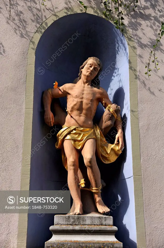 Life-sized, colored sculpture of Saint Sebastian from 1773 in a niche, Blütenstrasse, Fahr, Lower Franconia, Bavaria, Germany, Europe