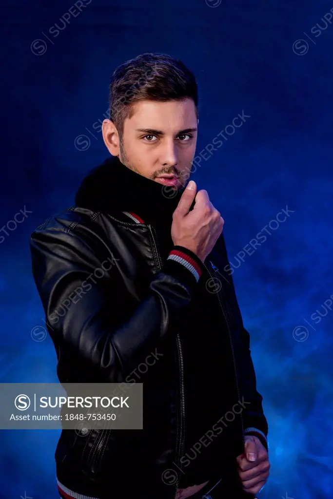 Young man wearing a black leather jacket