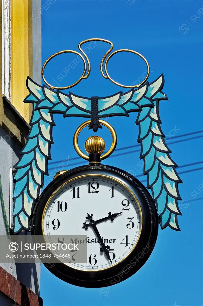 Pair of pince-nez and a pocket watch, hanging sign for an optician and watchmaker in Kochel am See, Bavaria, Germany, Europe