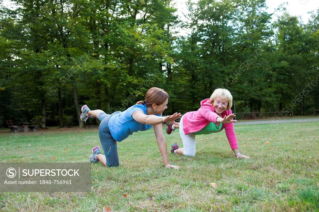 Women doing gymnastics outdoors