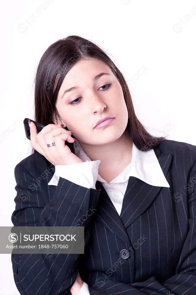 Businesswoman on the phone, looking bored