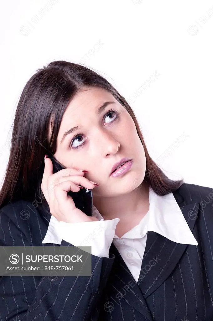 Businesswoman on the phone, looking annoyed