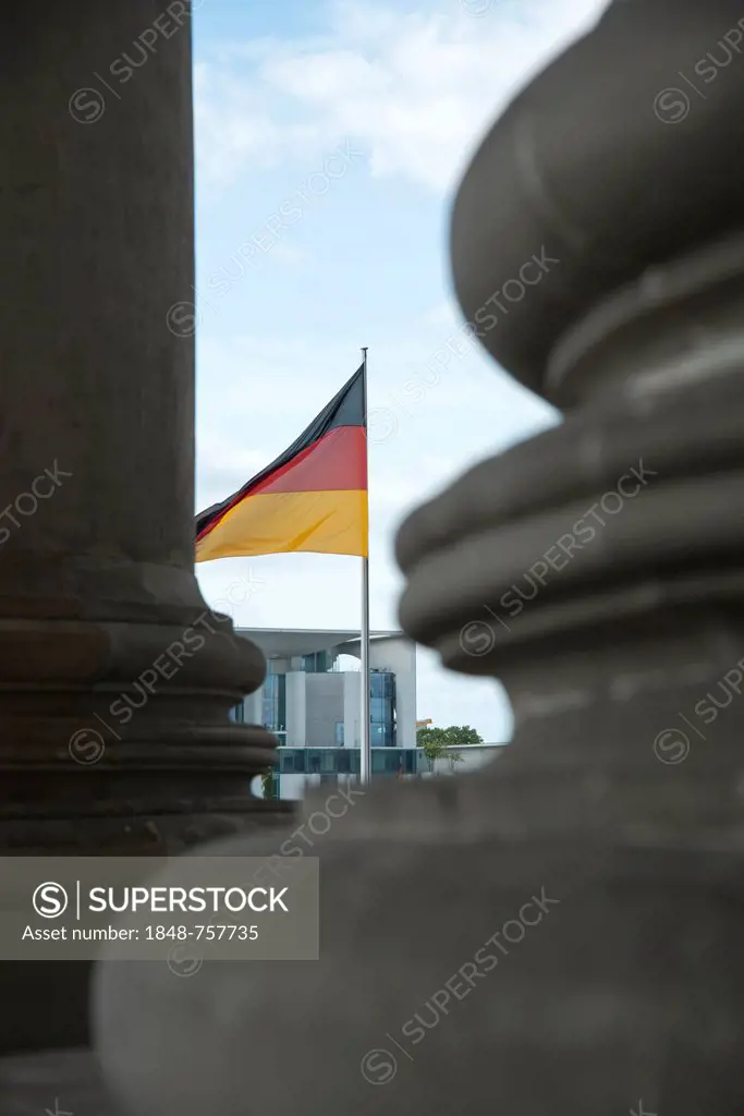 Details of columns in front of the Reichstag Building with the German flag and looking towards the Federal Chancellery in Berlin, Germany, Europe