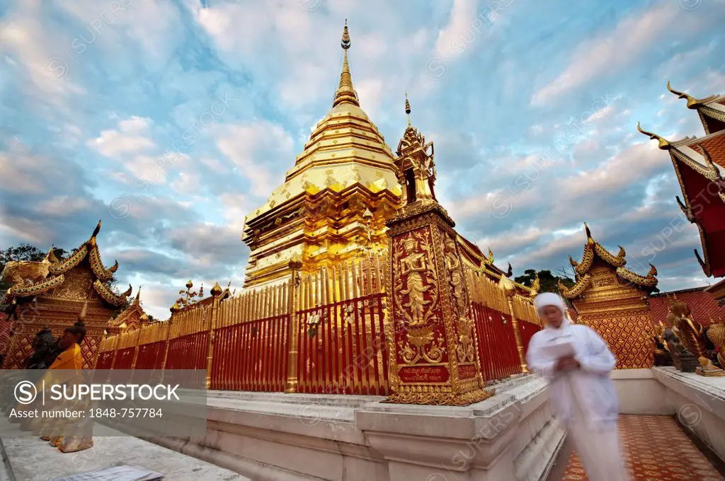 A devotee prays at Wat Doi Suthep Buddhist temple, Chiang Mai, Thailand, Asia