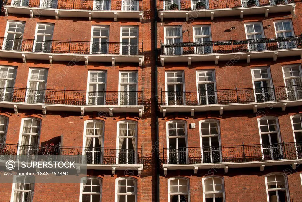 Curved facade of Red-brick Victorian Kensington Gore Mansions, Knightsbridge, London, England, United Kingdom, Europe