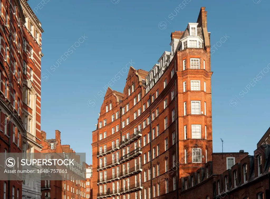 Curved building, red-brick Victorian Kensington Gore Mansions, Knightsbridge, London, England, United Kingdom, Europe