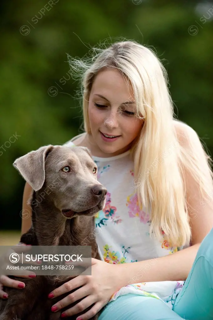 Woman with a Labrador Retriever