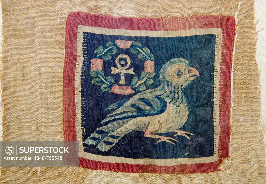 Textile panel depicting a bird with the wreathed cross that takes the form of the pharaonic ankh, the symbol for life, dating from 5 - 7th century AD ...