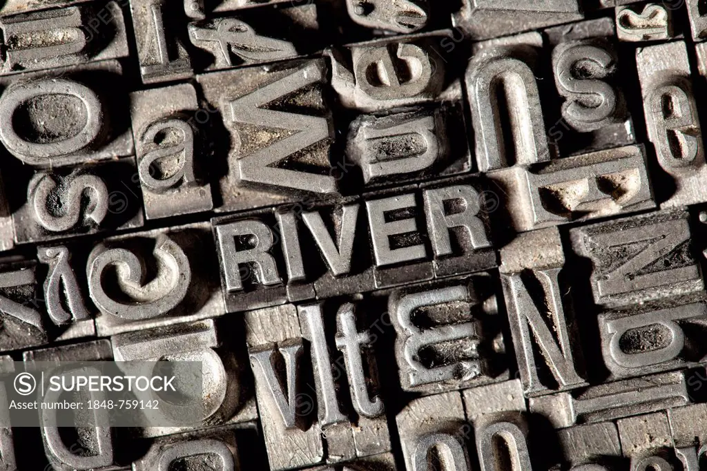 Old lead letters forming the word RIVER