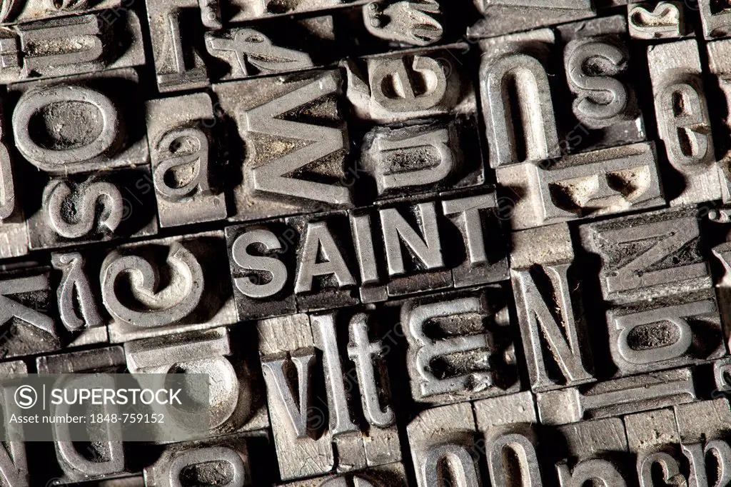 Old lead letters forming the word SAINT