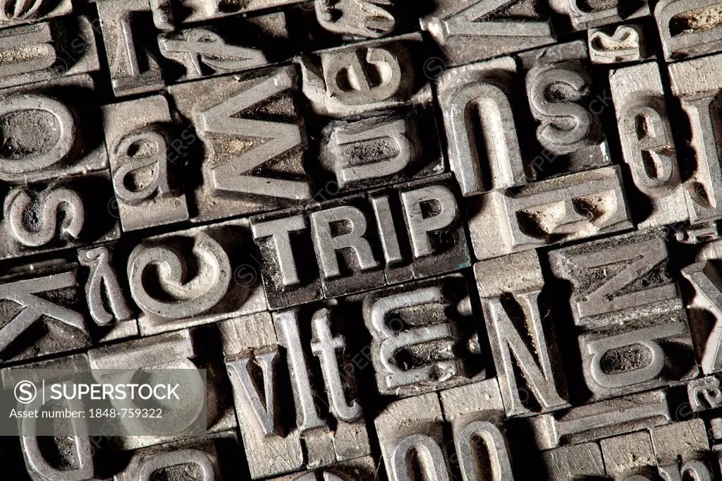 Old lead letters forming the word TRIP