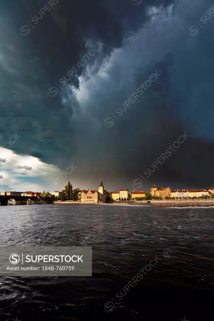 Moldova River during a thunderstorm, with Charles Bridge, Smetana Museum, the former waterworks, the Old Town Bridge Tower and the Water Tower