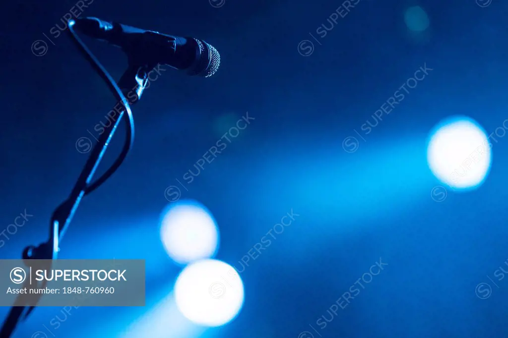 Microphone on a stand in the spotlight