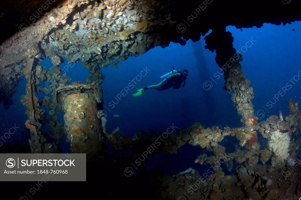 Scuba diver at the wreck of the Kyokuzan Maru, Japanese freighter sunk in 1944