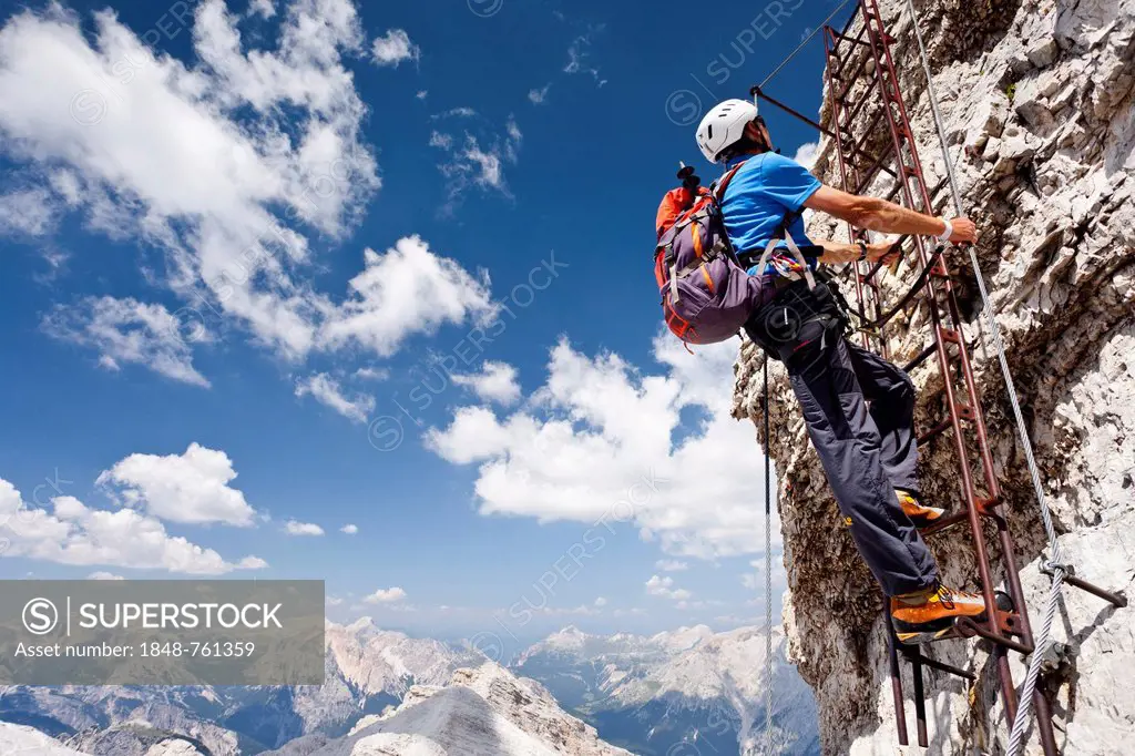 Climber ascending Monte Cristallo via the Via ferrata Ivano Dibona climbing route
