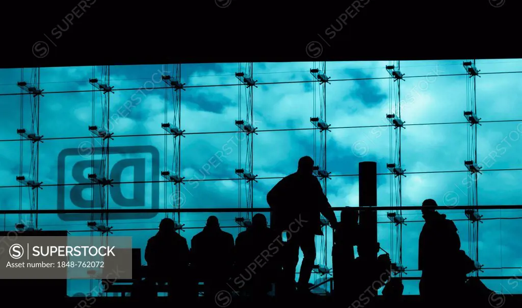 Silhouettes of travellers waiting for trains in the main station building, backlit, Berlin, Germany, Europe