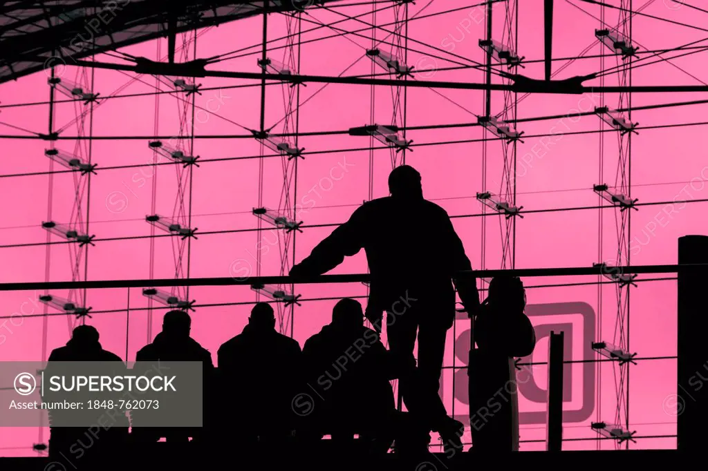 Silhouettes of travellers waiting for trains in the main station building, backlit, Berlin, Germany, Europe