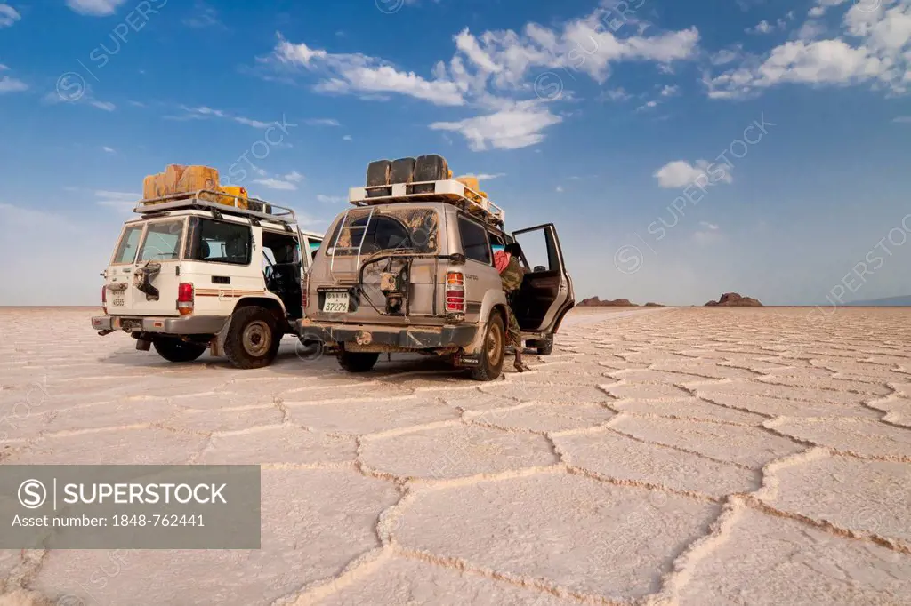 SUVs parked on the salt formations of the Ass Ale salt lake in the Danakil Depression