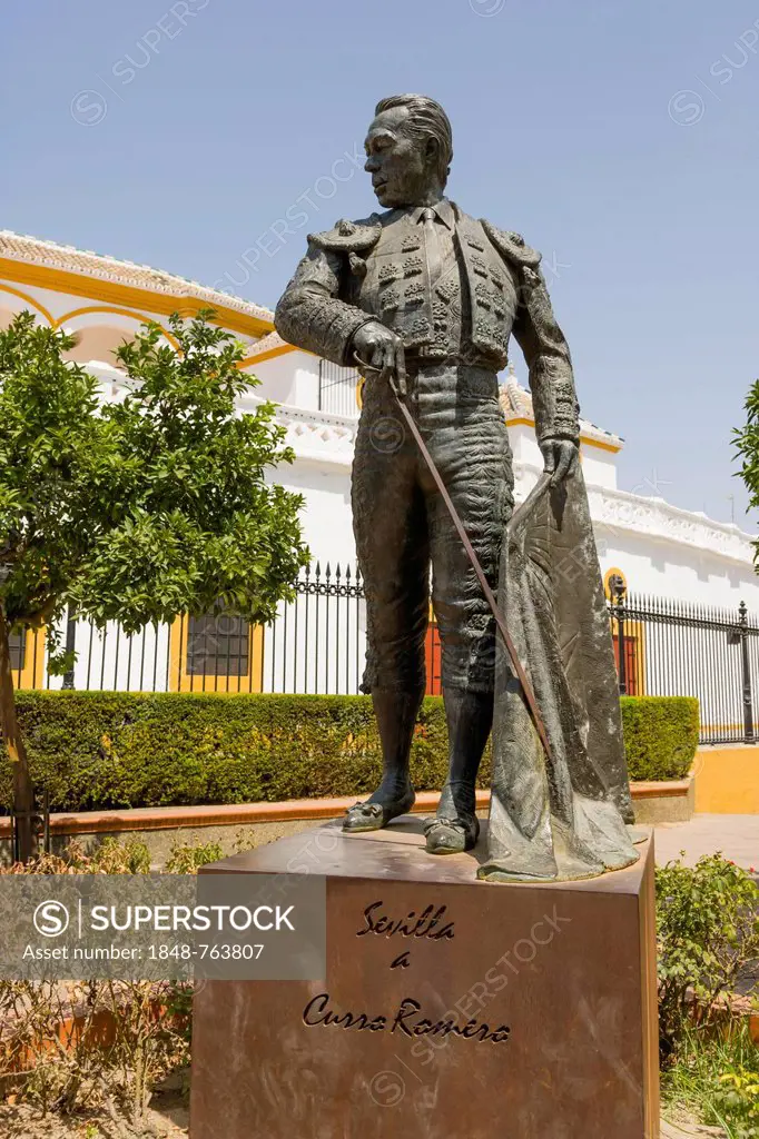 Sculpture of toreador Curro Romero near Plaza de toros de la Real Maestranza de Caballeria de Sevilla, bullfighting ring, Paseo de Cristobal Colon, El...
