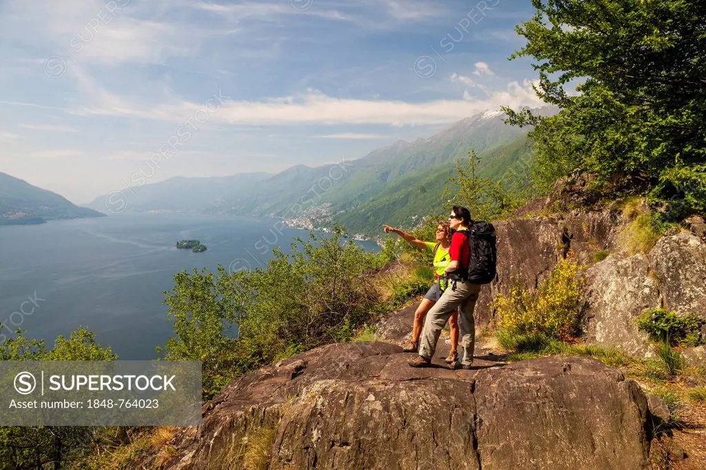 Two women hiking, Balladrum, viewpoint overlooking lake Lago Maggiore, Ticino, Switzerland, Europe