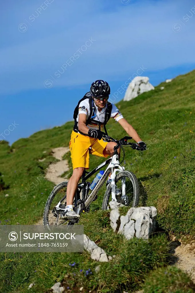 Mountain biker on Kampenwand Mountain, Chiemgau, Upper Bavaria, Bavaria, Germany, Europe