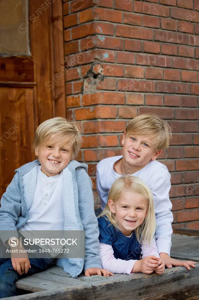 Three siblings, 9, 7 and 4 years old