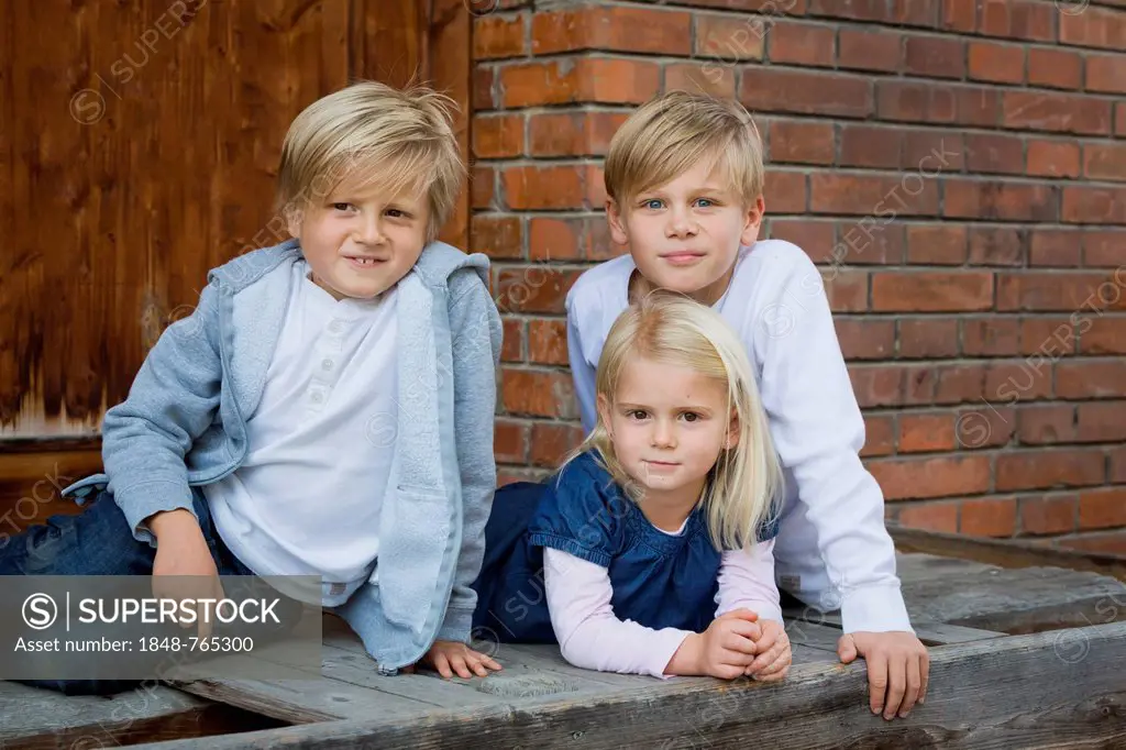Three siblings, 9, 7 and 4 years old