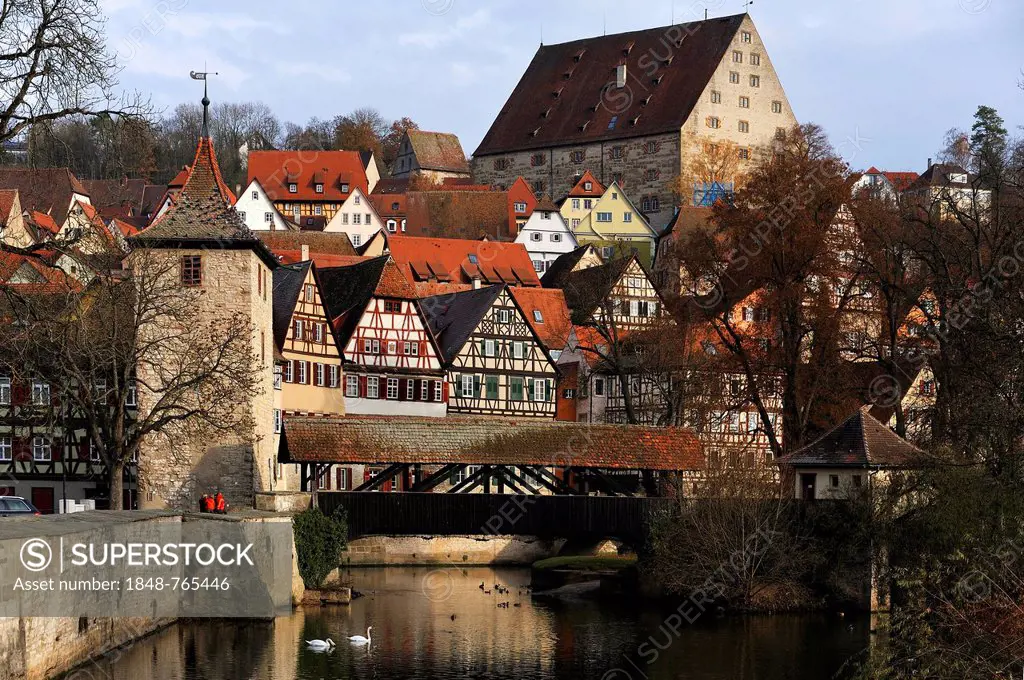 Overlooking the historic town centre of Schwaebisch Hall with Sulferturm tower and the Sulfersteg covered wooden footbridge crossing the Kocher River,...