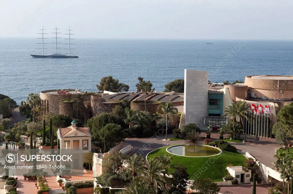 View from the balcony of the Monte Carlo Bay Hotel & Resort over the garden and Jimmy'z Night Club towards the sea with the large yacht Maltese Falcon...